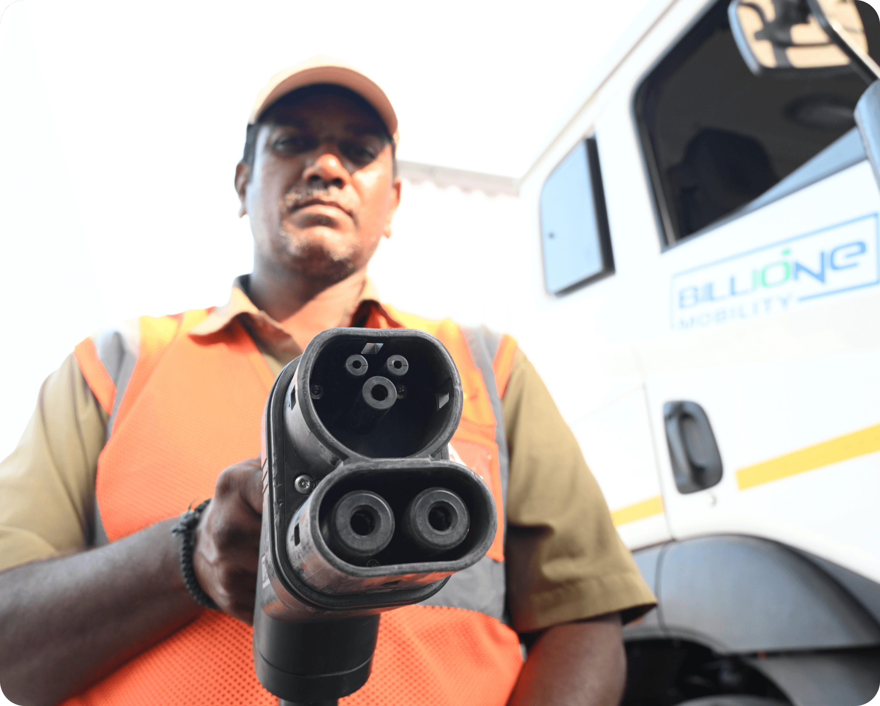 Man plugging charger into electric car